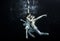 Underwater ballet dancers