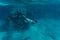 Underwater beaty woman in bikini snorkeling in a clear tropical water at coral reef