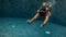 Underwater. Father and daughter swimming in the pool on father`s day