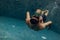 Underwater. Father and daughter swimming in the pool on father`s day.