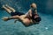 Underwater. father and his daughter swim in the pool on dad`s day.