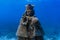 Underwater grotto of the holy child Jesus in a shallow coral reef