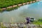 Underwater hunter diver man with  speargun preparing to dive on a life ring looks under the water in search of fish