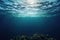 Underwater ocean. Sun rays shining through the water surface. Blue and teal transparent water.