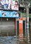 Underwater phone booth in front of a closed hostess cafe in a flooded street in Bangkok, Thailand, in October 2011