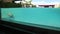 Underwater photo of caucasian man diving in the swimming pool with transparent glass wall in Atanaya hotel. Luxury