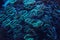 Underwater photo, coral under UV light, tentacles emitting blue and cyan. Abstract marine life background