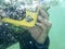 Underwater-photographer. Diver taking a photograph underwater. Ocean.