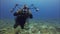 Underwater photographer.Underwater photography camera man close up taking photo in blue sea