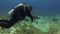 Underwater photographer. Underwater photography camera man or scuba diver in blue sea