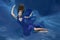 Underwater Queen. Girl mermaid. Underwater scene. A woman, a fashion model in the water in a beautiful dress swims like a fish