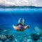 Underwater shoot of a young man snorkeling in a tropical sea on