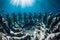 Underwater statues in blue ocean with fish. Underwater tourism in ocean.