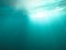 Underwater texture shot blue sea water with sunbeam