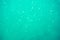 Underwater turquoise texture in ocean. Bubbles in tropical sea