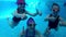 Underwater video of young friends in swimming pool