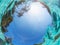 Underwater view of the sky. Outdoor swimming pool in tropical. Blue defocus background