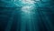 Underwater view with sunbeams shining and creating god rays in the deep sea