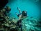 Underwater wide angle selfie of muscular swimmer in a crystal water