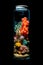 Underwater Wonders: Corals and Fish Captured in a Bottle Against a Black Background. created with Generative AI