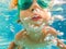 Underwater Young Boy Fun in the Swimming Pool with Goggles. Summer Vacation Fun