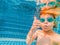 Underwater Young Boy Fun in the Swimming Pool with Goggles. Summer Vacation Fun