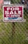 Undeveloped vacant lot with for sale sign