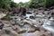 Undulating rocky landscape of the Boiling Pots at Wailuku River State Park in Hilo, Hawaii