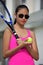 Unemotional Athlete Minority Girl Tennis Player Wearing Sunglasses With Tennis Racket