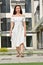 Unemotional Filipina Person Wearing Summer Dress Standing