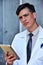 Unemotional Intelligent Male Surgeon Wearing Lab Coat