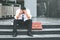 Unemployed Tired or stressed businessman sitting on the walkway