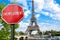 Unemployment sign on Eiffel tower background in Paris. Financial crash in world economy because of coronavirus. Global economic