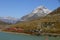 The Unesco World Heritage Bernina train at Bernina Pass in the upper Engadin