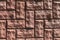 Uneven rough red bricks with asymmetrical masonry.