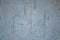 Unevenly colored shabby wall. Paint smears on wall texture. Grey abstract background