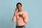 Unexpected Call. Surprised Young Black Woman Talking On Cellphone Over Blue Background