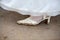Unexpected Moments: Bridal Shoe on Muddy Ground