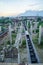 Unfinished bridge. Abandoned industrial rusty metal and concrete ruins. Support concrete pillars