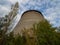 Unfinished cooling tower in Chernobyl zone at afternoon.