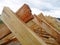 Unfinished house rooftop roofing construction trusses, wooden beams, eaves, timber.  House roof wooden frame construction