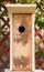 Unfinished new homemade birdhouse made of wood