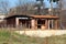 Unfinished partially built red brick summer house with new roof tiles and gutter pipes