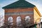 The unfinished red brick house, at sunset, the roof for the people. Architecture in Rostov region.