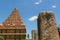 Unfinished and ruined pillars with main tower in the Brihadisvara Temple in Gangaikonda Cholapuram, india.