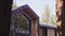 Unfinished wooden cottage with new windows in summer forest