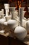 Unfired greenware vases and pots