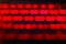 Unfocused blured red and black background bokeh. Blurred bright light