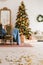 Unfocused classic christmas interior with new year tree decorated