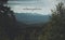 Unfocused dramatic foggy highland pine mountain in north Europe nature scenery landscape and title atmosphere in center of